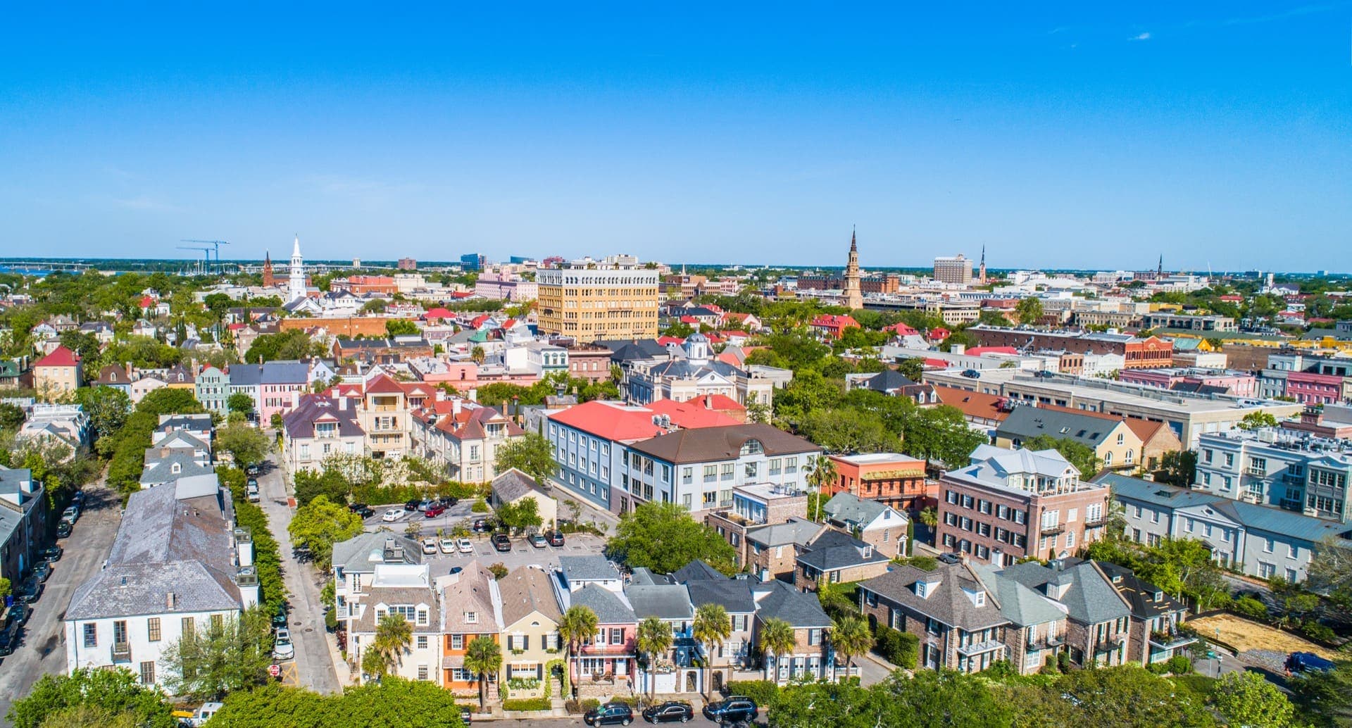 Aerial view of downtown Charleston rooftops and church steeples